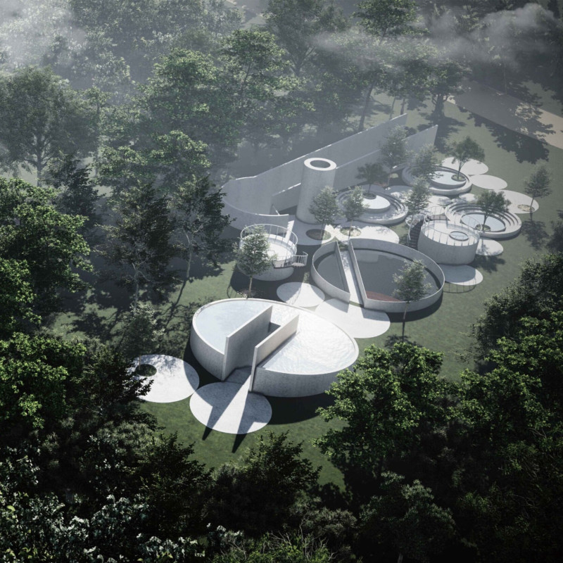 Cascading Water Features Enhancing Concrete Facades in a Circular Columbarium Space  