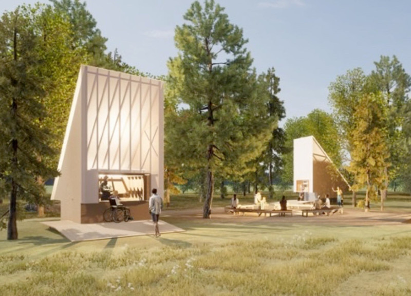 Charred Wooden Shingles and Translucent Polycarbonate Envelop a Community Gathering Space in a Forest Setting