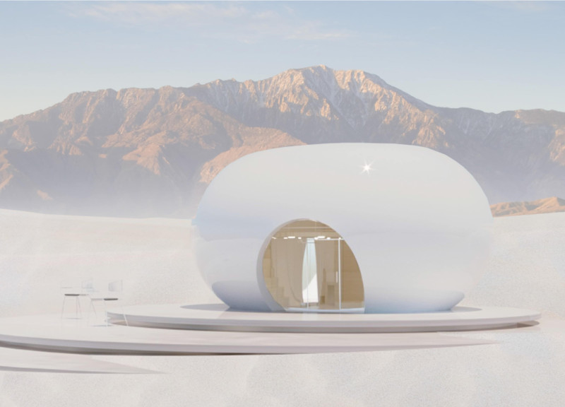 Eco-friendly home featuring a 3D printed carbon-fiber shell and passive design in a desert setting  
