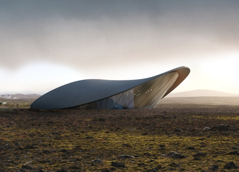 Basalt Structure Blending Into Volcanic Landscape With Reflective Glass Facade  